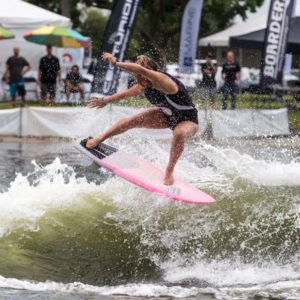 A woman competing in wake surfing.