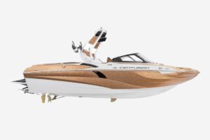 A boat that attracts surfers and fans with its golden and brown color scheme, perfect for exhilarating wake surfing experiences.