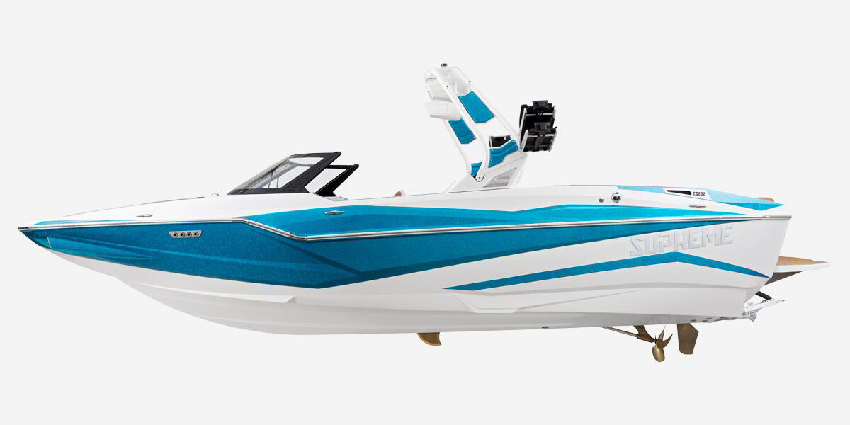 A blue and white speed boat, perfect for wake surfing competitions, stands out against a clean white background.