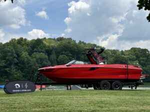 A red boat on a trailer, gleaming in the sun, ready for the Centurion WSWS event.