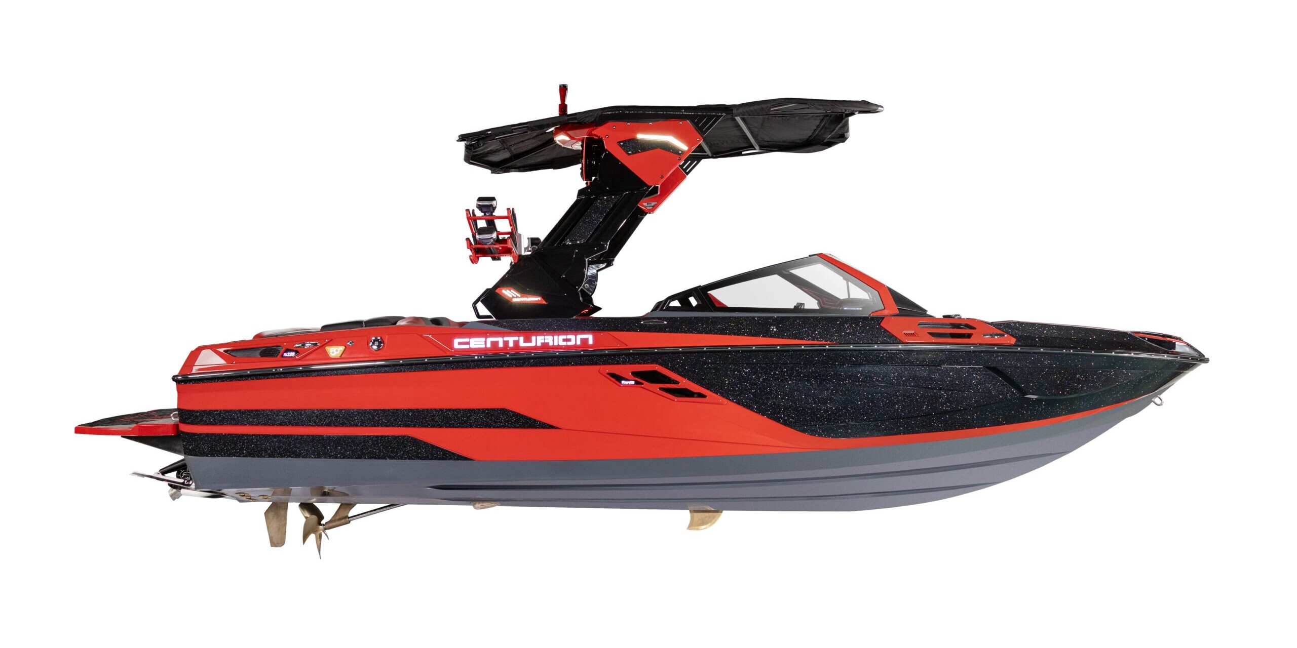 A red and black Centurion speedboat with a black wakeboard tower, as seen in the World Series of Wake Surfing, viewed from the side against a white background.