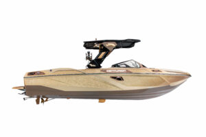 A gold Centurion Ri Series motorboat with a black wakeboard tower, viewed from the side against a white background.