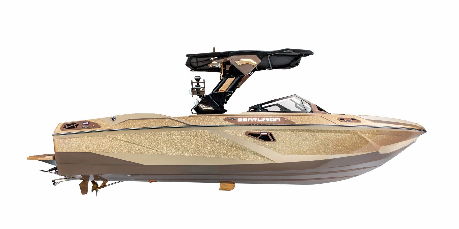 A gold Centurion Ri Series motorboat with a black wakeboard tower, viewed from the side against a white background.